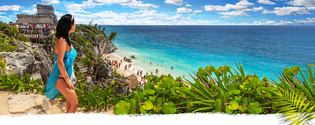 Photo of a Young Woman Watching the Sea at Tulum Ruins